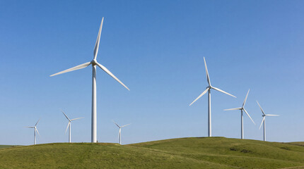 Fototapeta premium Wind Turbines Generating Clean Renewable Energy on Green Hills
