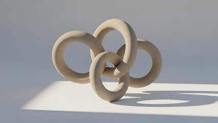 Modern abstract sculpture with interconnected rings on white surface