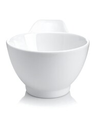 A white ceramic bowl with a small handle on one side