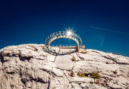 Aerial view of the glass-bottomed Skywalk Biokovo perched atop rugged cliffs under a brilliant sun and deep blue sky, Biokovo, Splitsko-dalmatinska &Aring;&frac34;upanija, Croatia.