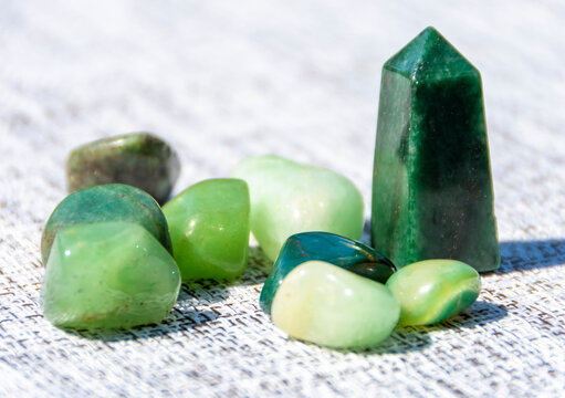 A close-up of a natural mineral against a light background. Mineralogy. Creating handmade items from natural stone.