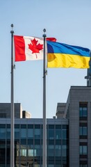 Fototapeta premium Canada and Ukraine Flags Waving Together in Solidarity.