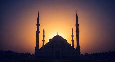 Obraz premium Silhouette of a grand mosque against a sunset, creating a dramatic, symmetrical scene