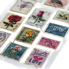 A collection of vintage postage stamps with floral designs and love themes