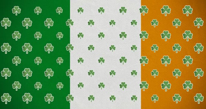 Digital animation of multiple clover leaves moving against irish flag