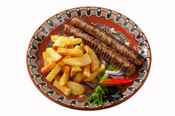 Kebabs with fries and salad