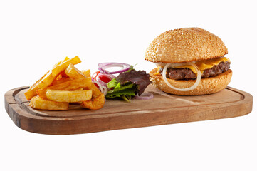 Hamburger with potatoes and vegetables on a wooden board