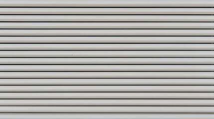 Obraz premium Vertical white and gray stripes creating a modern textured pattern 
