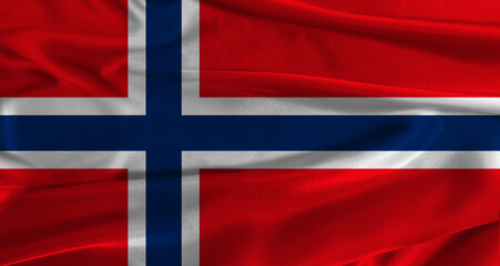 Fototapeta premium Flag of Norway with fabric textured background. Close up of National flag of Norway with realistic texture