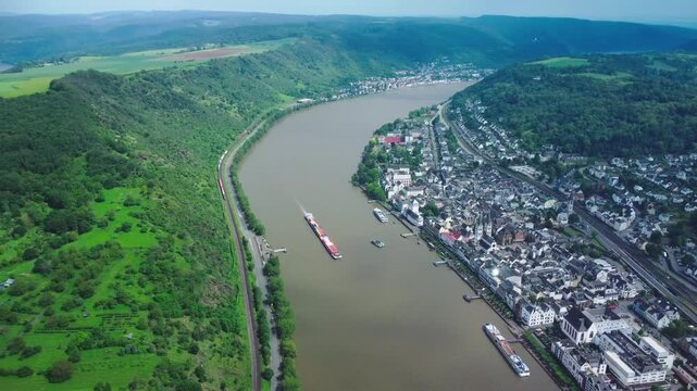 Aerial view of Boppard in the Rhine Valley, with boats on the river and trains passing by
