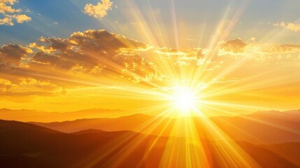 Dramatic golden hour sunset over mountain range with powerful sun rays and glowing sky