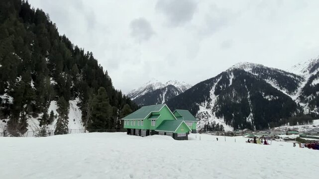 Peaceful natural landscape of Aru Valley featuring lush green meadows, pine forests, flowing rivers, and majestic Himalayan mountains near Pahalgam, Kashmir.