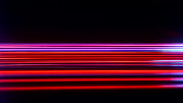 Vibrant Red and Purple Light Trails on Black Background.