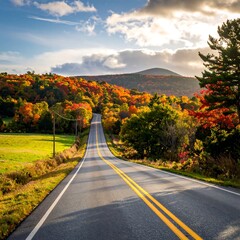 Obraz premium Autumn Road - A Scenic Drive Through Vermonts Colorful Foliage.