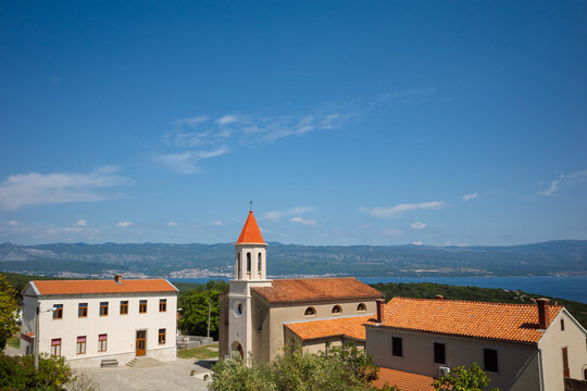 Small Romanesque Chapel with Red Pyramidal Spire Overlooking the Adriatic Sea, Risika, Krk Island, Croatia