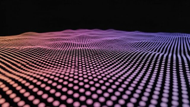 Vibrant digital landscape with wavy pattern of pink, purple, and orange dots on a black background, creating a mesmerizing and futuristic visual effect with gradient colors.