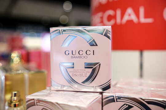 Moscow, Russia - January 25, 2026: Gucci Bamboo perfume box displayed on a shelf with blurred background of other fragrance products in store