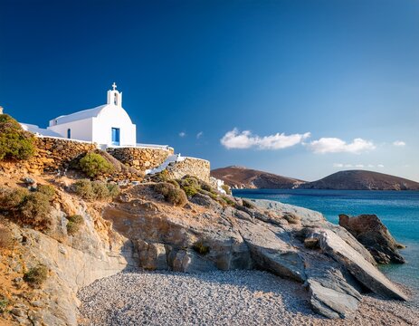 whitewashed st george church stands upon the rocky hill above a quiet beach on kea island also known as tzia