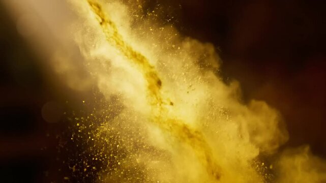 Golden gulal powder cloud burst representing joy and celebration during the sacred hindu festival of holi
