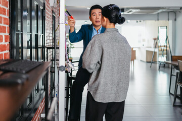 Professional Colleagues Brainstorming Ideas in a Modern Collaborative Workspace
