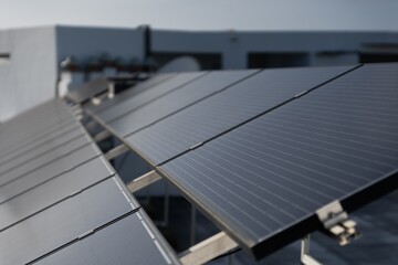 Obraz premium Solar Panels Installed on a roof top of a house. 