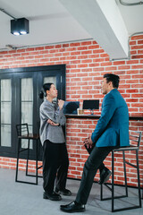 Professional Colleagues Brainstorming Ideas in a Modern Collaborative Workspace