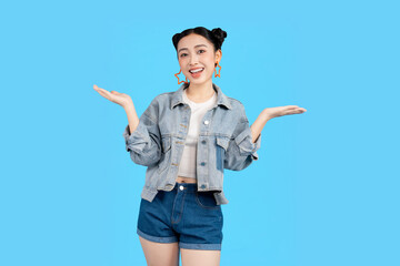 young Asian woman gestures with open arms on a blue background