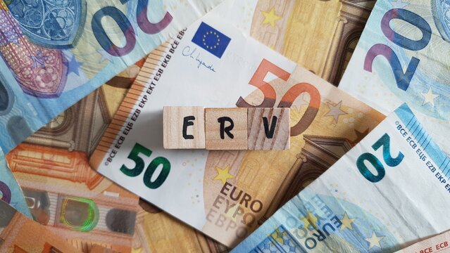 ERV acronym made of wooden letter cubes on pile of Euro banknotes. Einkommensbezogene Rentenversicherung (Income-Based Pension Insurance)