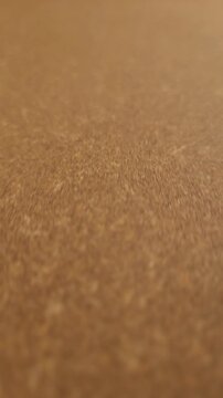 Warm brown leatherboard sheet surface with fine pressed fiber texture.