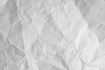 Obraz premium Worn paper texture with creases and rough surface. White sheet background perfect for vintage