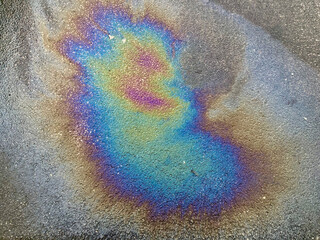 A cosmic-looking or meteorite impact pattern which is formed by an oil film interference on the surface of water © Steve travelguide