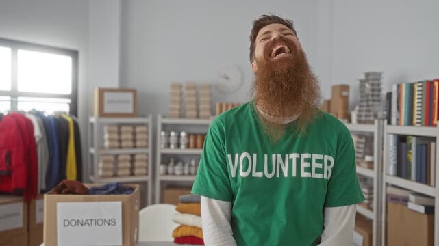 Man laughs beside a cardboard donations box filled with supplies on metal shelves in a building; altruism joy community spirit.