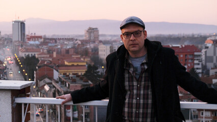 Portrait of a handsome man engineer on a building rooftop 
