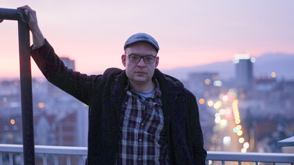 Portrait of a handsome man engineer on a building rooftop 