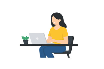 Woman working on a laptop at a desk with a small potted plant