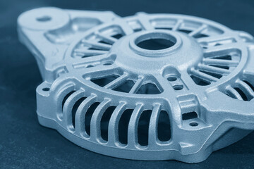 Obraz premium Close Up Aluminum Alternator Case Components for Automotive Engineering in Light Blue Scene