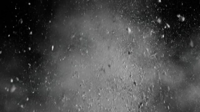 White Powder Explosion on Black Background.