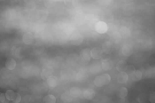 Gray background, photo of tinted snow with blur effect