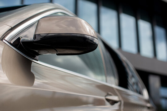 Bmw x5 suv side mirror reflecting building