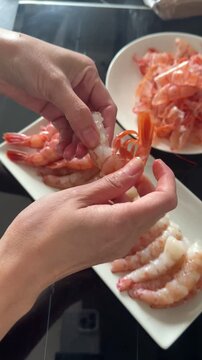 Peeling and cleaning shrimp, chef preparing food
