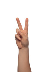 Naklejka premium A female hand performs the iconic peace sign, with fingers extended and thumb out, isolated against a pure white background for versatile use.