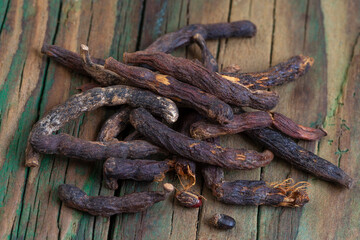 Dried Roots Displayed on Wooden Surface