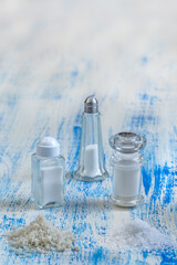 Salt Containers on a Blue Wooden Table