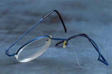 Blue Glasses Placed on a Gray Surface