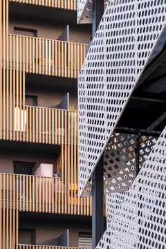 Modern apartment facade architecture contemporary urban building with metal screen and wood pattern for residential real estate in Montpellier France