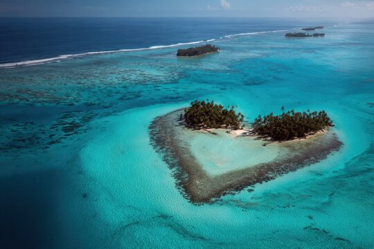 Heart shaped island forming a romantic tropical paradise