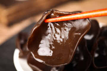 Rich Chocolate Coating on Stick with White Filling Detail