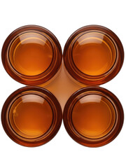 Four amber glass containers isolated on transparent background