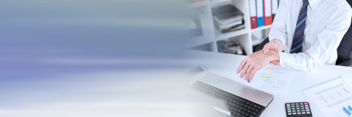 Fototapeta premium Businessman suffering from wrist pain; panoramic banner