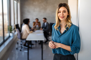 Successful executive standing proudly in office, representing business growth, partnership